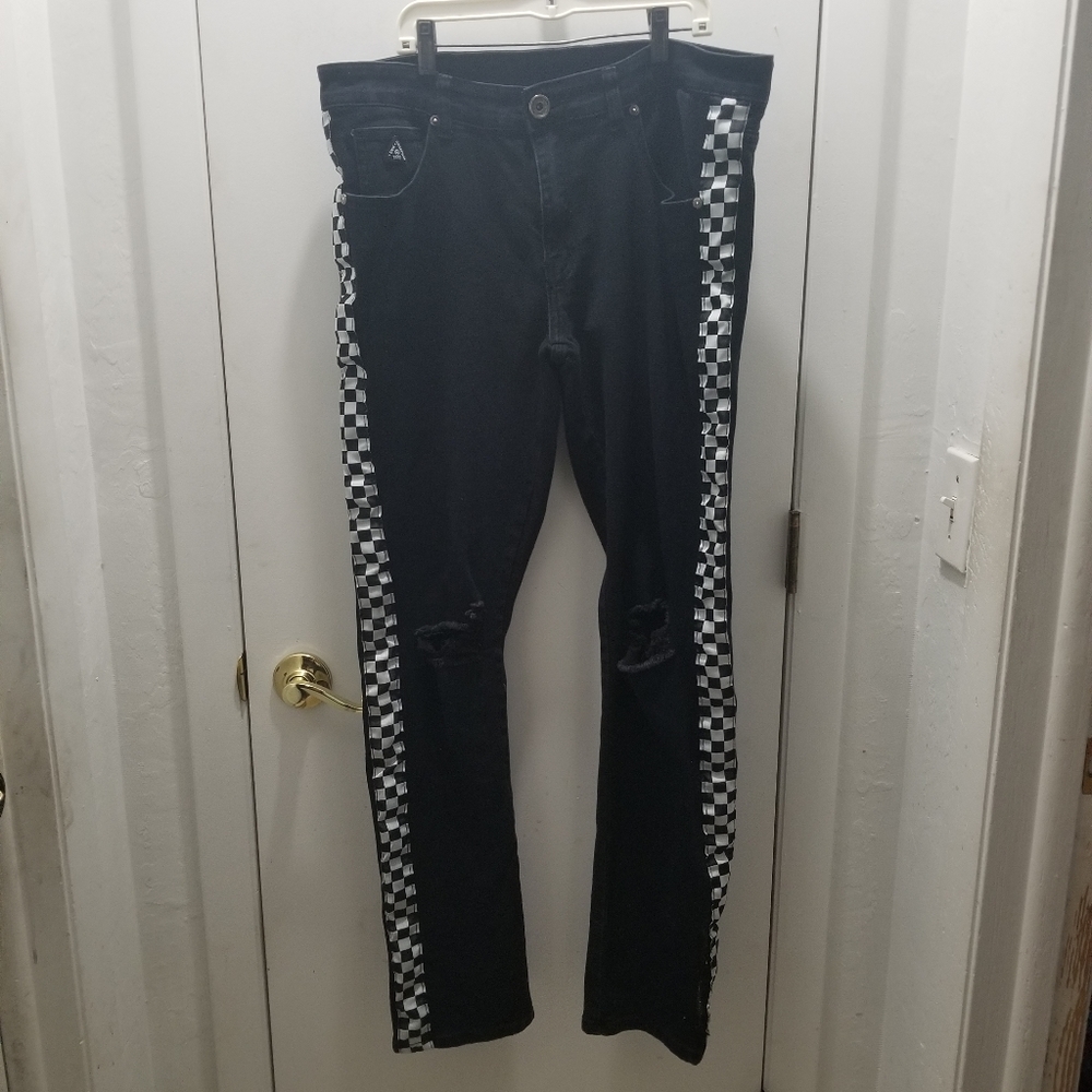 BLK DNM Collection. Black Distressed ripped Jean's Checkerboard on the s…